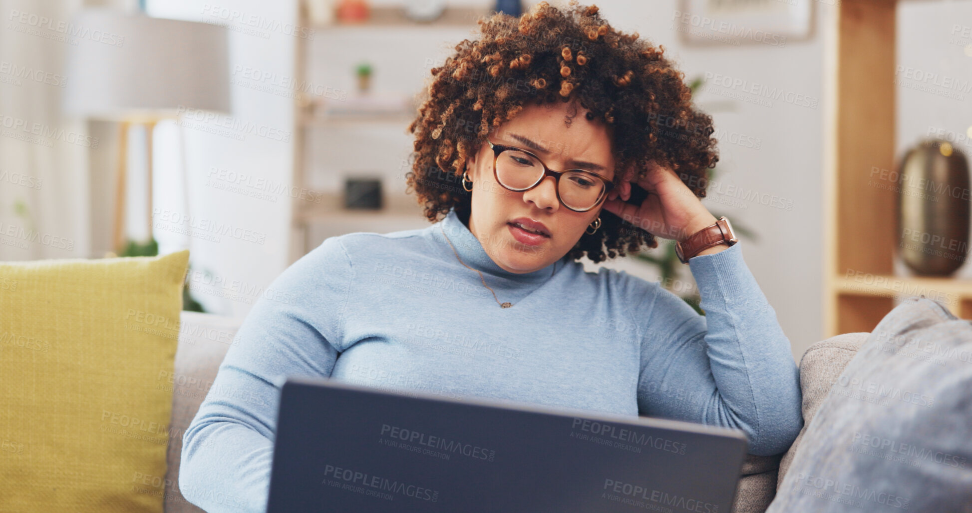 Buy stock photo Woman, student and stress on laptop for home education, e learning or college application results, news or fail. Young, confused african person with doubt, mistake or reading on computer and sofa