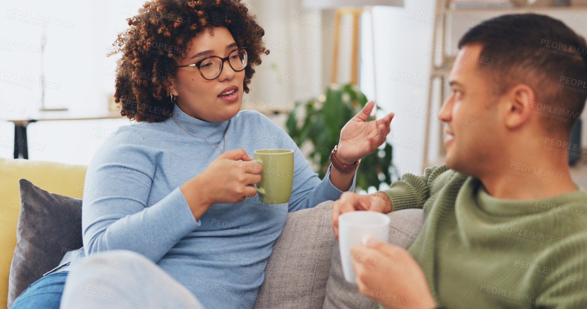 Buy stock photo Home coffee, relax and talking couple drink morning tea, latte and consulting on relationship advice, news or story. Lounge sofa, beverage and marriage people speaking, conversation and storytelling