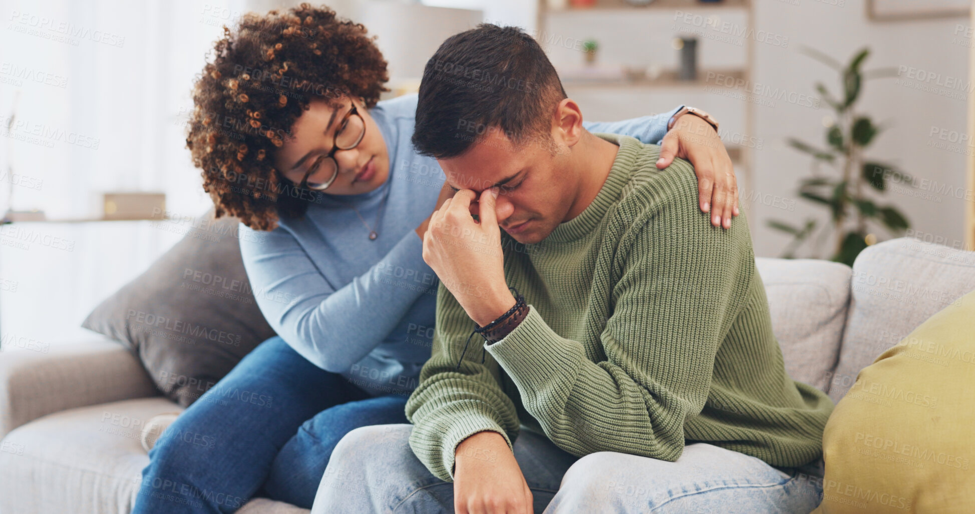 Buy stock photo Woman comfort man, sad and sofa for hug, care or love for mental health, grief or loss in home living room. Couple, kindness and empathy with embrace for support, solidarity or crying on lounge couch