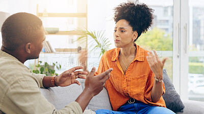 Buy stock photo Divorce, sad and a black couple fighting on a sofa in the living room of a home in disagreement. Cheating, crying or breakup with an unhappy man and woman arguing about marriage problems in a house