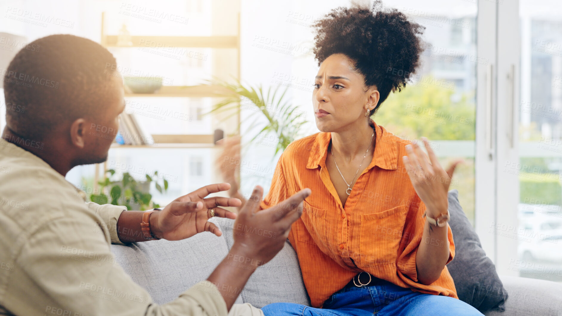 Buy stock photo Divorce, sad and a black couple fighting on a sofa in the living room of a home in disagreement. Cheating, crying or breakup with an unhappy man and woman arguing about marriage problems in a house