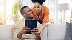 Tablet, smile and couple on sofa in home living room, bonding and online shopping. Interracial, technology and happy black man and woman relax on social media, internet browsing or web scrolling.