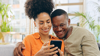 Buy stock photo Couple, smile and hug with phone for social media, funny joke and post for bonding on sofa. Happy man and woman, diversity and streaming comedy movie or series, browsing and web scrolling for love