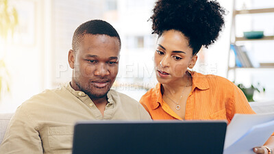 Buy stock photo Black couple, laptop and documents with financial savings on living room sofa discussing mortgage payment. Home, African man and woman together with paperwork for finance budget or money investment