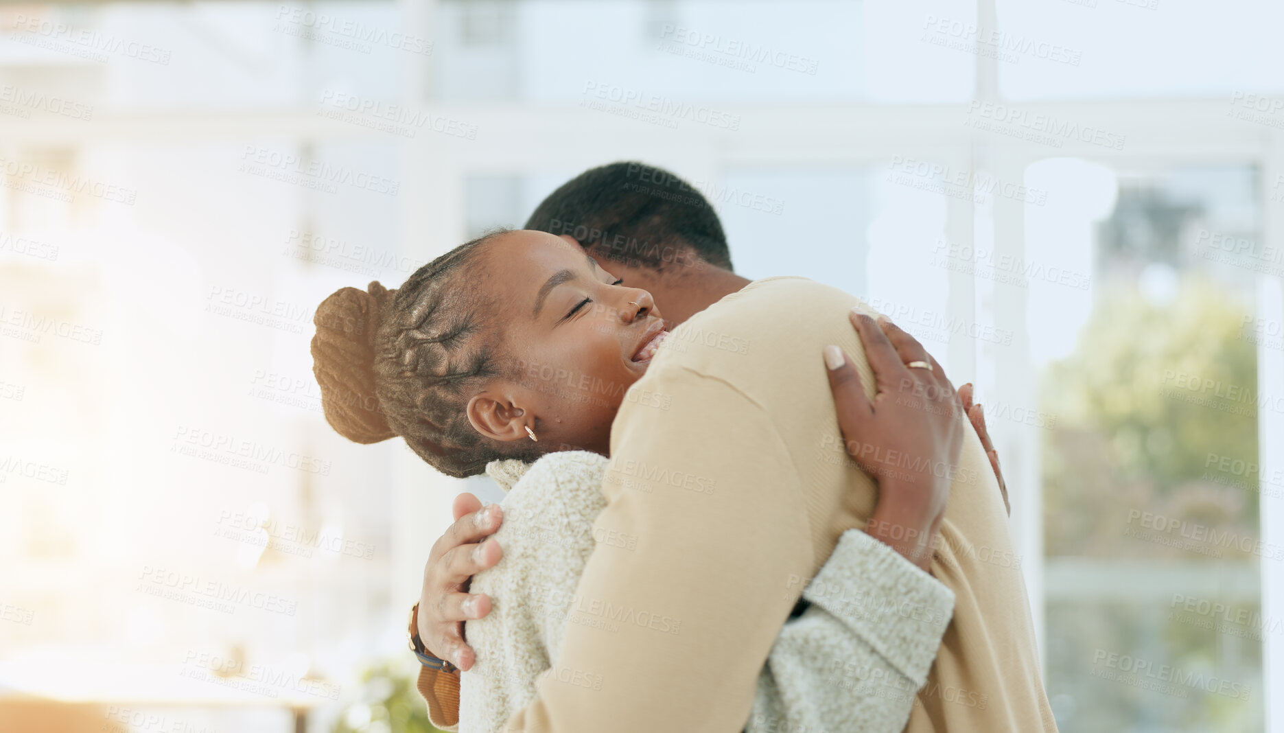 Buy stock photo Love, care or black couple hug in home living room together to relax or bond for peace, support or trust. Embrace, commitment or romantic man with an African woman with smile in marriage connection