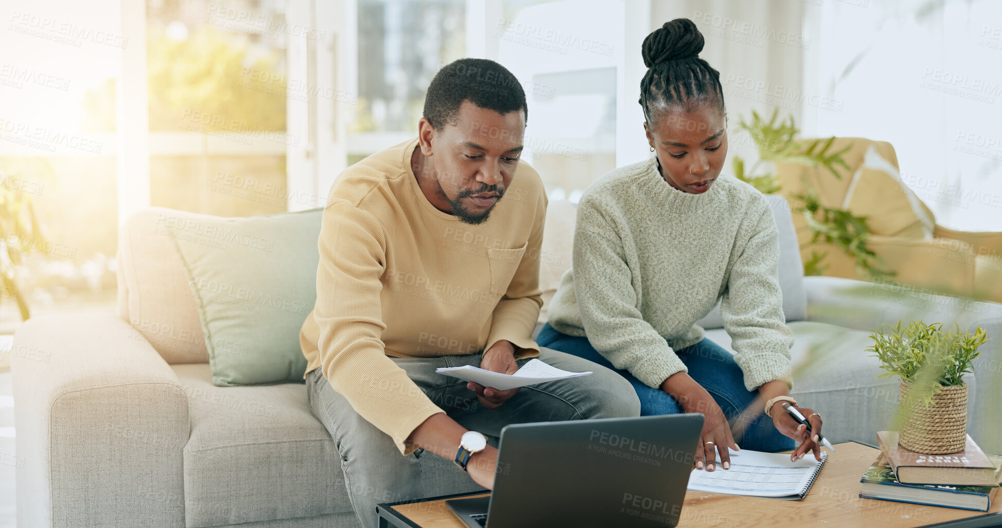 Buy stock photo Black couple, laptop or paperwork for budget mortgage, expenses or schedule payments at home. African man, planning or woman reading bills, documents or finance info on living room sofa for taxes