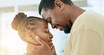 Black couple, forehead and smile for love, affection or romance together in happy relationship at home. African American man and woman touching heads laughing and smiling for loving embrace indoors