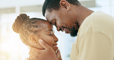 Buy stock photo Forehead, care or black couple hug in home living room together to bond for peace, support or trust. Intimate embrace, commitment or romantic man with a happy African woman with empathy in marriage