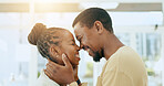 Black couple, forehead and smile for love, affection or romance together in happy relationship at home. African American man and woman touching heads laughing and smiling for loving embrace indoors