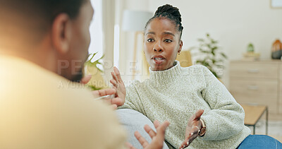 Buy stock photo Black couple, conflict and argument on sofa in home living room with questions, anger or mistake in relationship. African man, woman and fight with stress, divorce or frustrated face on lounge couch