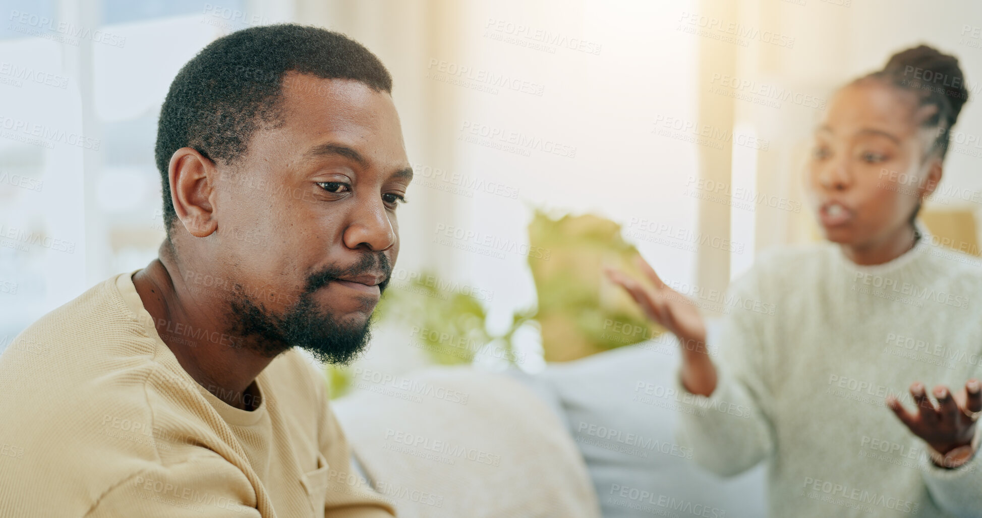 Buy stock photo African couple, conflict and fight on sofa in home living room for questions, anger or mistake in relationship. Black woman, man and argument for stress, divorce and frustrated for cheating in lounge