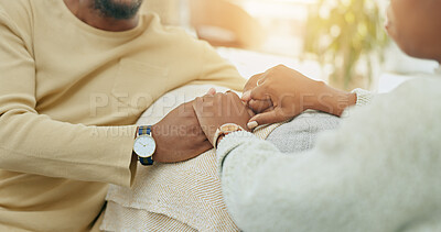 Buy stock photo Home, closeup and couple holding hands, love and comfort with marriage, support and relationship. Apartment, man and woman with bonding, trust and partnership with respect, empathy and commitment