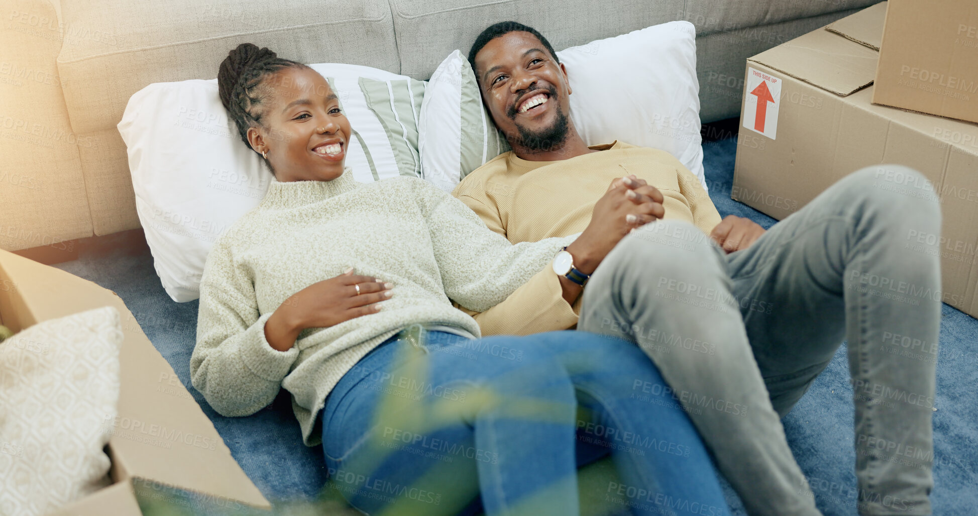 Buy stock photo African couple, floor and holding hands to new home, moving and pride with smile for real estate dream. Black woman, man and happy together on carpet for investment, property and house with boxes