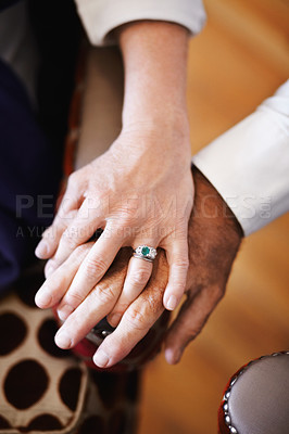 Buy stock photo Closeup, holding hands and senior couple with love, empathy and comfort with support, solidarity and help. Zoom, hand and old woman and elderly man with care, bonding and grief with loss and trust