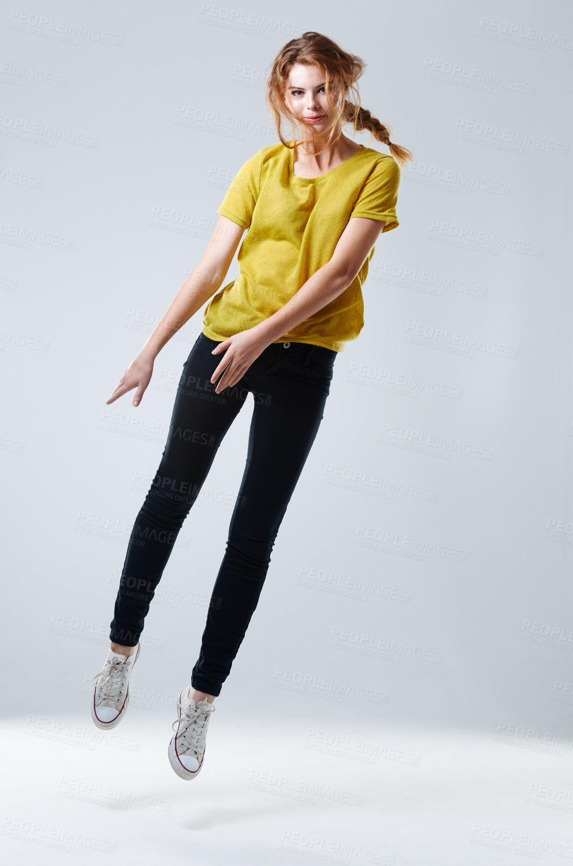 Buy stock photo Side, jump and portrait of woman with fashion, style and cool clothes with sneakers in studio. Young model, white background and female person floating with body in air, freedom and youth culture