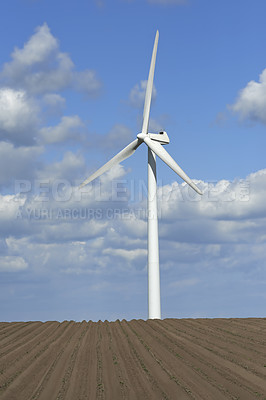 Buy stock photo Wind turbine, blue sky and wheat field with farmland for eco friendly environment or alternative energy in countryside. Landscape, clean air and renewable power with farm for sustainable ecosystem