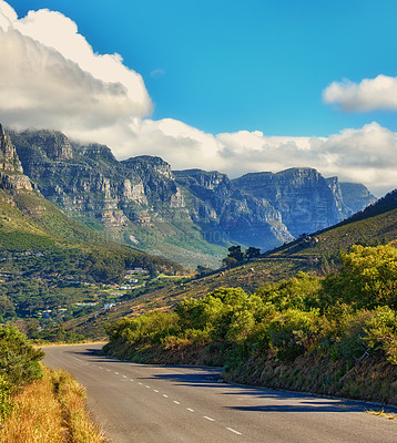 Buy stock photo Copy space with a mountain pass along the Twelve Apostles in Cape Town, South Africa against a cloudy sky background over a peninsula. Calm and scenic landscape to travel or explore on a road trip