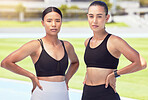 Fitness, workout and exercise friends outdoor on a sports track, stadium or arena with healthy body. Women with motivation and focus after cardio training and looking strong, wellness and slim 