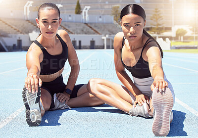 Buy stock photo Fitness, stadium and women stretching hamstring on racetrack ready to start training, exercise and cardio workout. Wellness, girls and portrait of healthy runners at a sports competition in summer