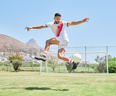 Buy stock photo Soccer player field, man soccer ball trick and control outdoor on grass for sports, fitness and health. Jump football skill, young sport athlete and kick freestyle on pitch for wellness in Cape Town