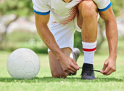 Buy stock photo Sports, soccer and man tie shoe on field, ready for game, match and outdoor training. Fitness, exercise and soccer player tying shoelace on sneaker before workout on soccer field for good performance