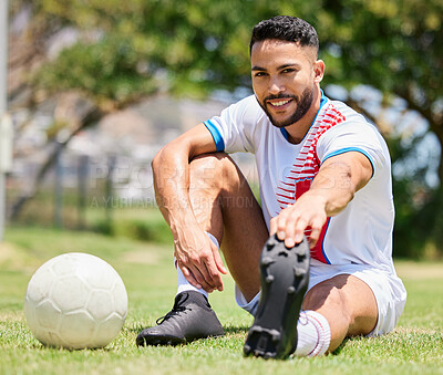 Buy stock photo Soccer ball, field and man stretching legs on grass for sport training or exercise workout. Portrait of young happy athlete, healthy lifestyle motivation and cardio warm up for football competition