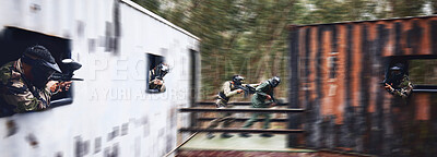 Paintball, gun or people running in a shooting game with fast action on a fun battlefield on holiday. Men on mission, war or players with military weapons gear for survival in an outdoor competition