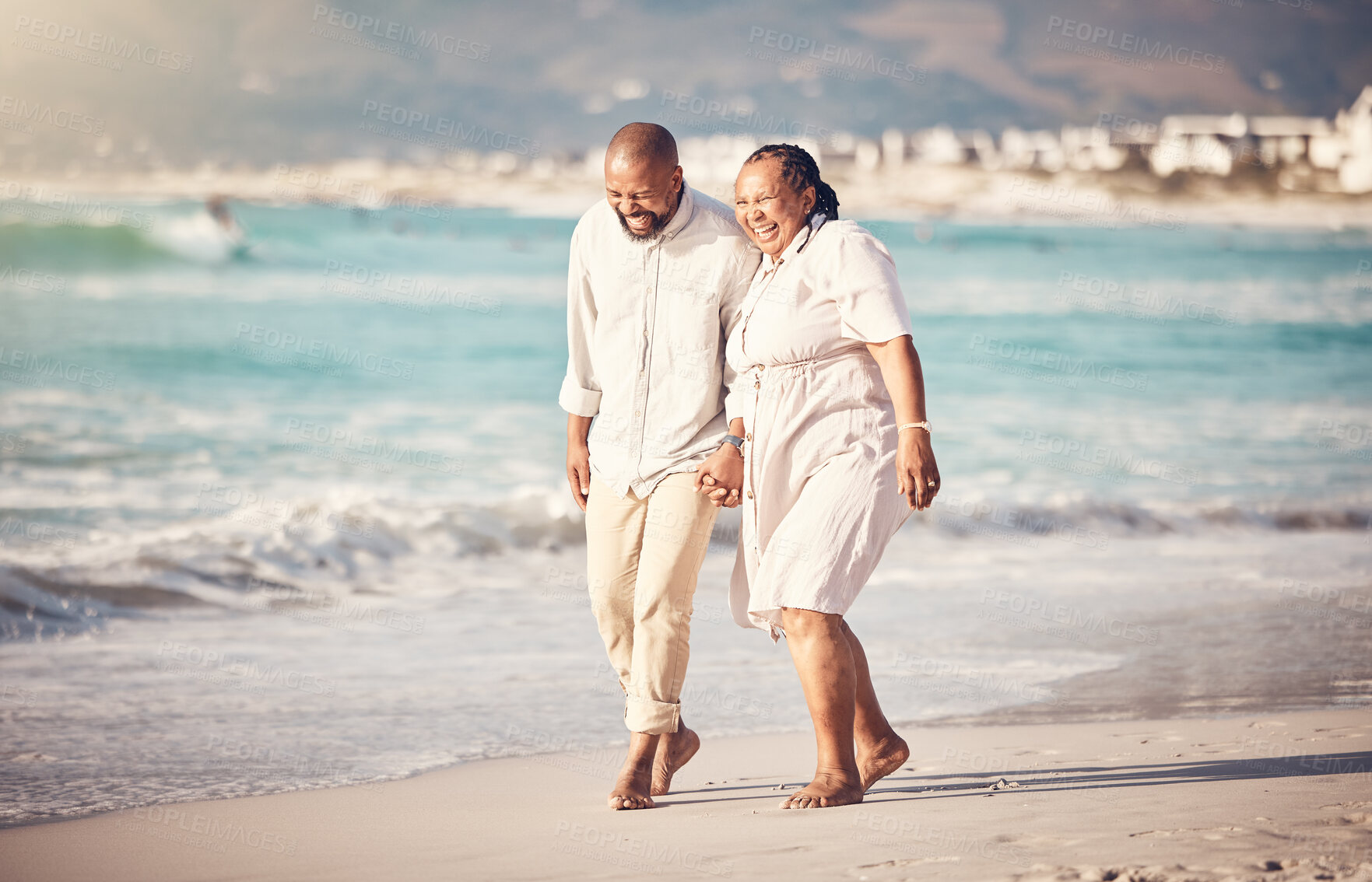 Buy stock photo Love, hand holding and senior with black couple at beach and laugh on retirement, vacation and summer break. Travel, smile and and bonding with man and woman walking for happy, funny and relax