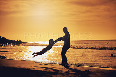 Buy stock photo Sunset, silhouette and father with son spinning at beach for bonding, support and summer break. Travel, playing and vacation with black man and child swinging for holiday trip, weekend and happiness