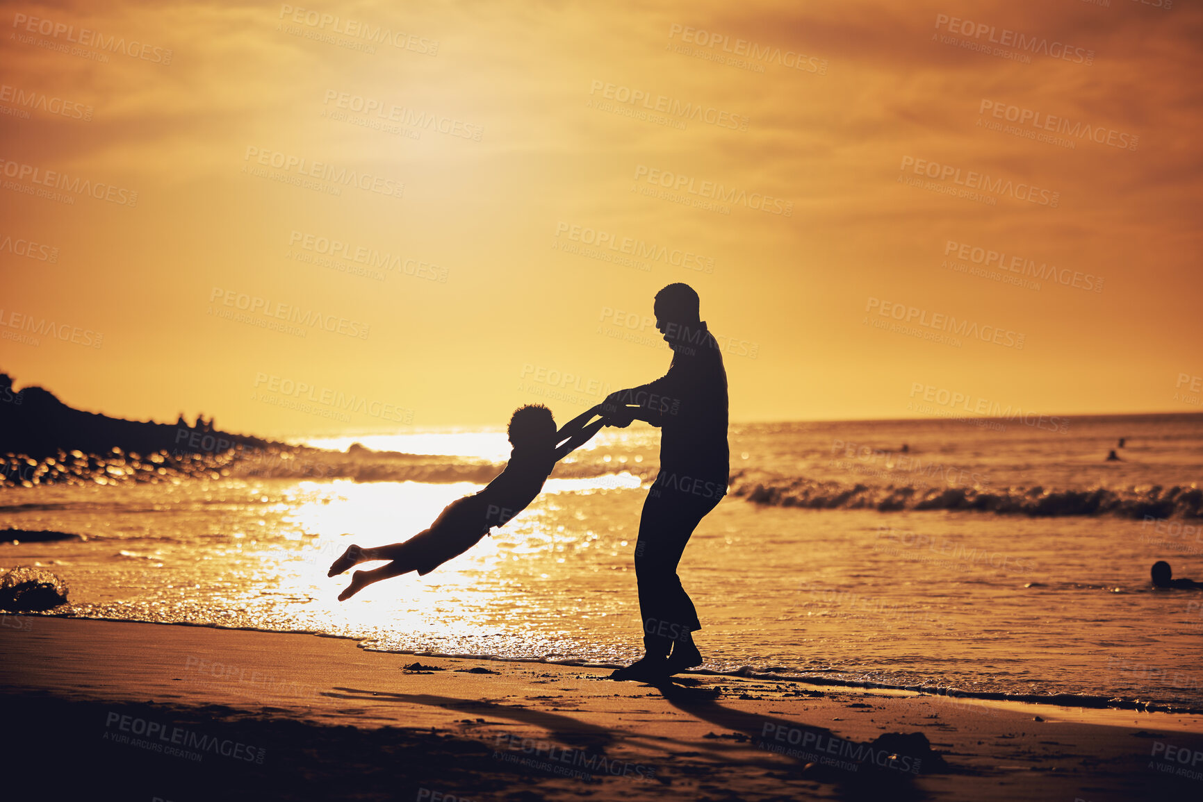 Buy stock photo Sunset, silhouette and father with son spinning at beach for bonding, support and summer break. Travel, playing and vacation with black man and child swinging for holiday trip, weekend and happiness