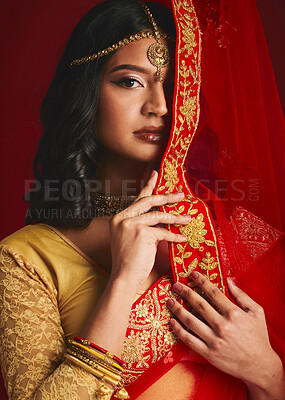Buy stock photo Fashion, traditional and portrait of Indian woman with veil in ethnic clothes, jewellery and sari. Religion, beauty and female person on red background with culture accessory, cosmetics and makeup