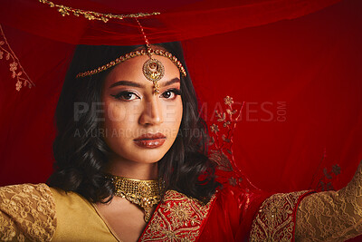 Buy stock photo Fashion, veil and portrait of Indian woman with jewellery in traditional clothes, beauty and sari. Religion, culture and face of female person on red background with accessory, cosmetics and makeup