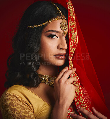 Buy stock photo Fashion, beauty and portrait of Indian woman with veil in traditional clothes, jewellery and sari. Religion, culture and eyes of female person on red background with accessory, cosmetics and makeup