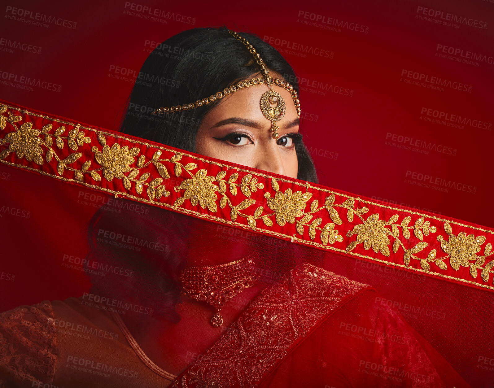 Buy stock photo Fashion, culture and portrait of Indian woman with veil in traditional clothes, jewellery and sari. Religion, beauty and eyes of female person on red background with accessory, cosmetics and makeup