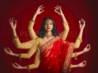 Buy stock photo Indian woman, portrait and goddess with many hands in studio background with sari and jewellery. Mudra, girl and beauty face with meditation with dress or movement with culture or spirituality.