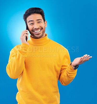 Buy stock photo Happy, conversation and portrait of an Asian man on a phone call for communication and networking. Smile, technology and a person speaking on a mobile isolated on a blue background in a studio