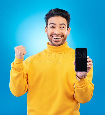 Buy stock photo Success, portrait and man with phone screen against a blue background for achievement. Technology or app, winning or celebrating and male person with smartphone cheering for sales deal announcement 