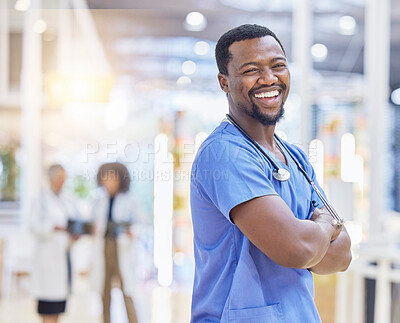 Buy stock photo Nurse, portrait and black man with arms crossed, funny and excited in hospital. African surgeon, face and confident medical professional, happy employee or healthcare worker laughing for wellness.