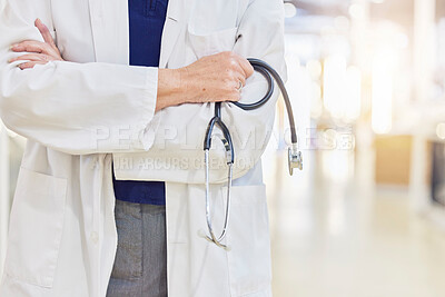 Buy stock photo Hands, arms crossed and doctor with stethoscope for cardiology, healthcare or wellness in hospital. Medical professional, expert and heart equipment to monitor for health checkup with confidence.
