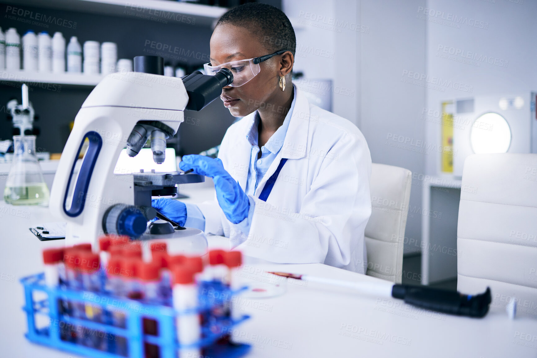 Buy stock photo Science, laboratory and woman on microscope for blood test research, medical analysis and dna or virus tube. Biotechnology, healthcare and scientist, doctor or african person check for particles