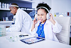 Crazy, lab and child with music and tablet for science with a father or scientist for work or learning. Funny, future and a comic girl streaming audio on tech with a person for innovation in medicine