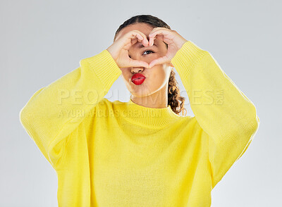Buy stock photo Woman, portrait and heart hands for love, care or romance in casual fashion against a white studio background. Female person with hand in support emoji, sign and symbol for health or wellness