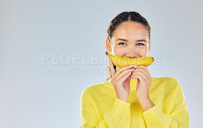 Buy stock photo Happy, banana and portrait of woman with fruit in studio for healthy eating, wellness and diet. Food, lose weight and mockup person on white background with fruits for nutrition, detox and digestion