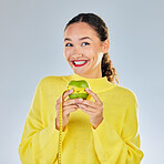 Tape measure, apple and portrait of woman with fruit in studio for healthy eating, wellness and diet. Food, lose weight and female person on white background with apples for nutrition and detox
