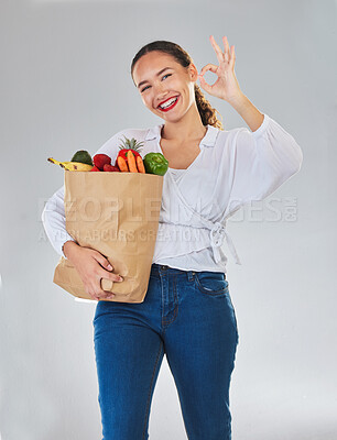 Buy stock photo Groceries, okay sign and woman in portrait with food excellence and promotion, sale or discount. Person, bag and grocery shopping, healthy fruits and vegetable and ok emoji on studio white background