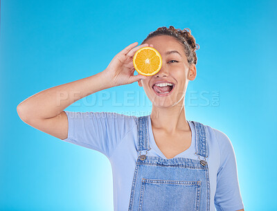Buy stock photo Portrait, tongue out and woman with orange in studio isolated on a blue background. Face, fruit and person with food for healthy diet, nutrition or wellness, eating and vitamin c, benefits and vegan.