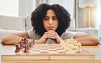 Chess, thinking and face of woman with game for strategy, problem solving and challenge at home. Competition, planning move and female person with chessboard in living room ready for playing games