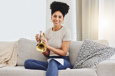Buy stock photo Portrait, woman and trumpet in home for music, learning and practice classic jazz song. Happy young female person, musician and brass horn instrument on sofa, living room and hobby of musical talent