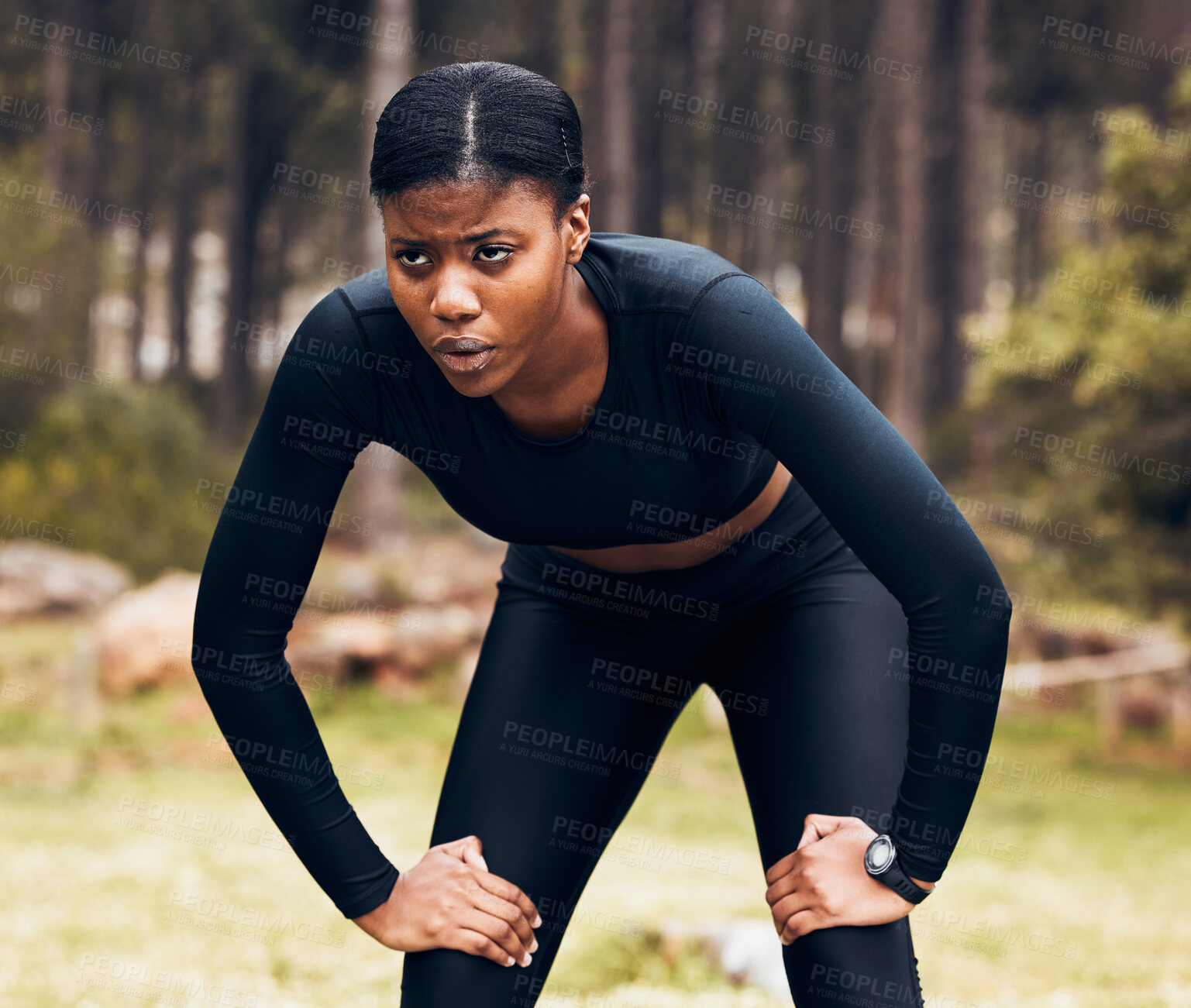 Buy stock photo Tired, fitness and black woman athlete rest doing an outdoor exercise, running and workout in nature or a forest. Morning, break and young female person or runner with fatigue and endurance training