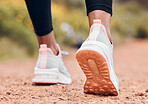 Shoes, fitness and person walking or hiking for outdoor exercise, workout or training as health and wellness. Sneakers, closeup and feet of active sports athlete or runner running a marathon